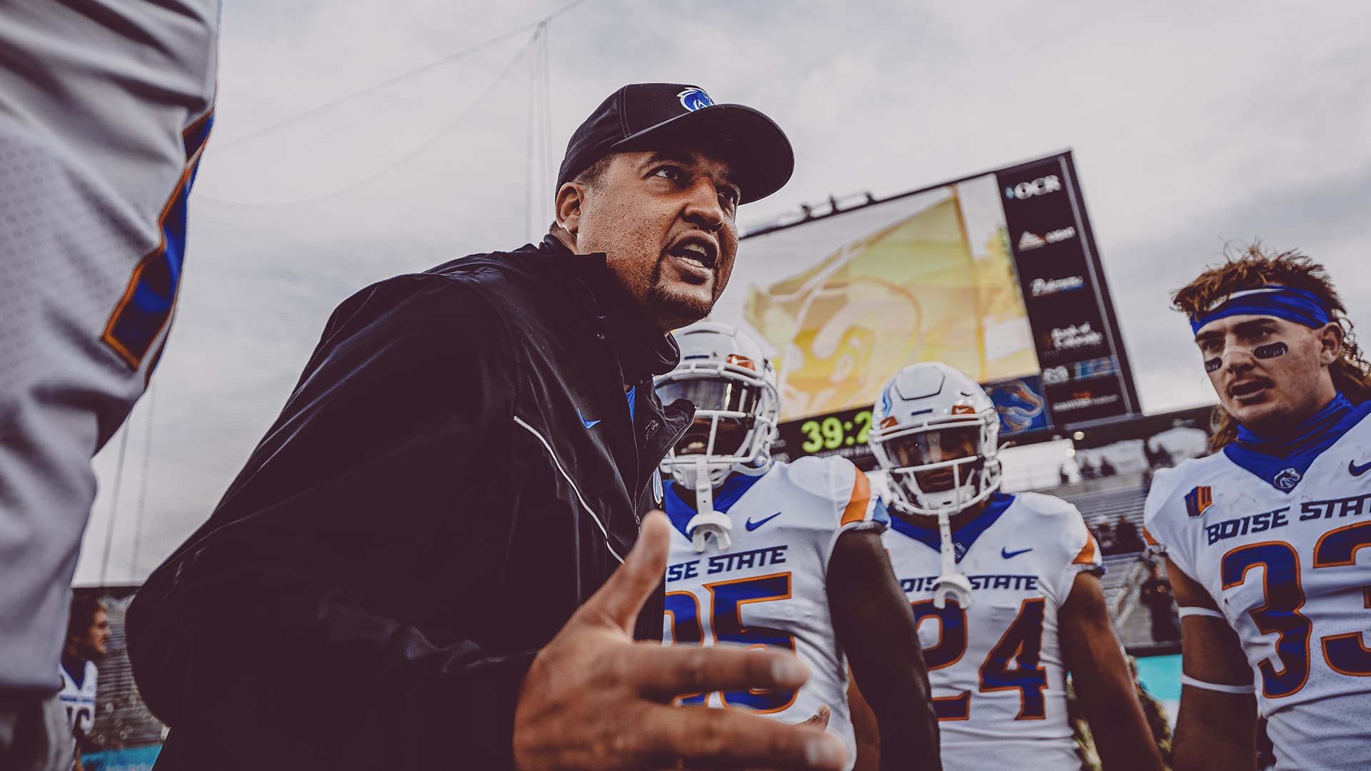 Winston coaching athletes on the field